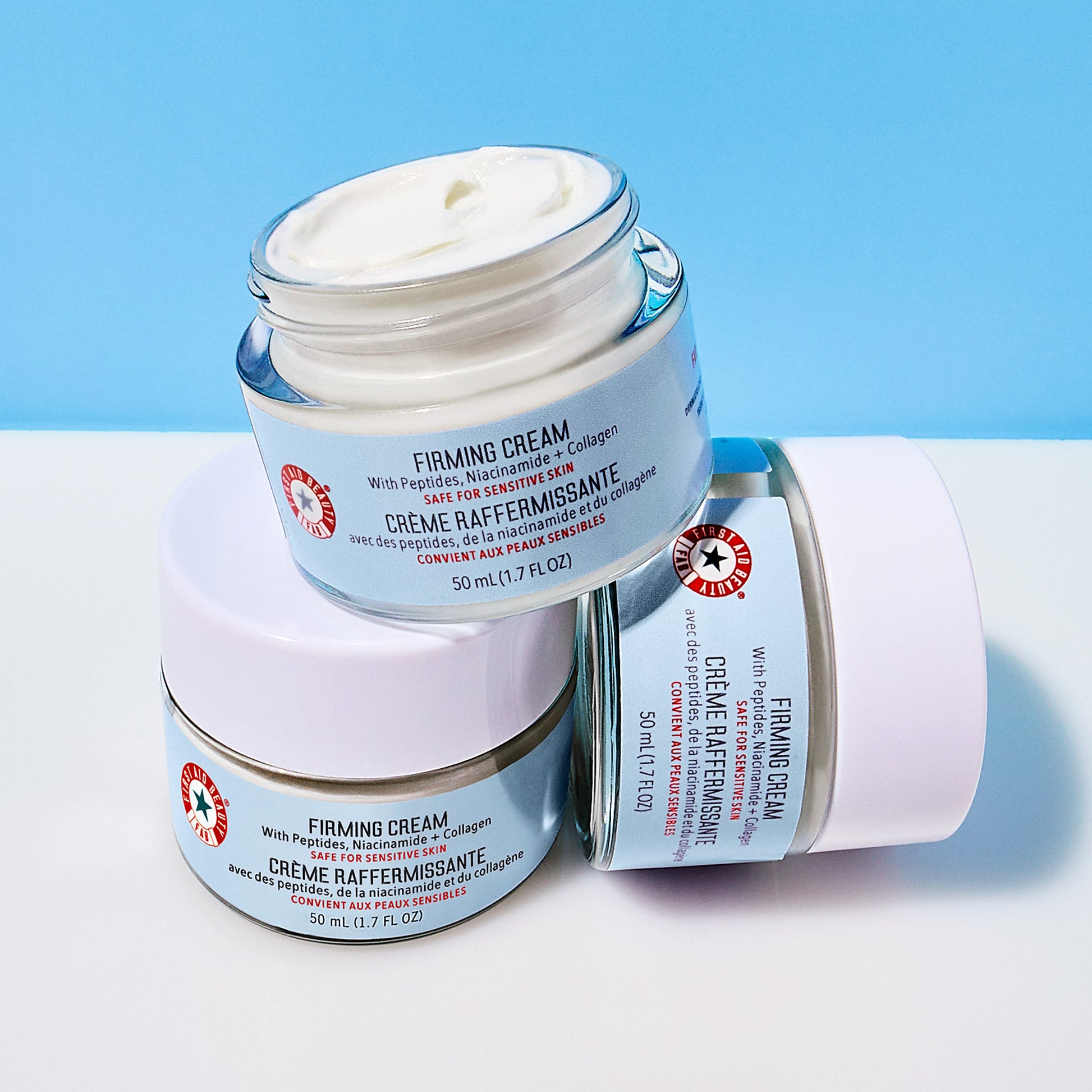 Three stacked jars of Firming Cream