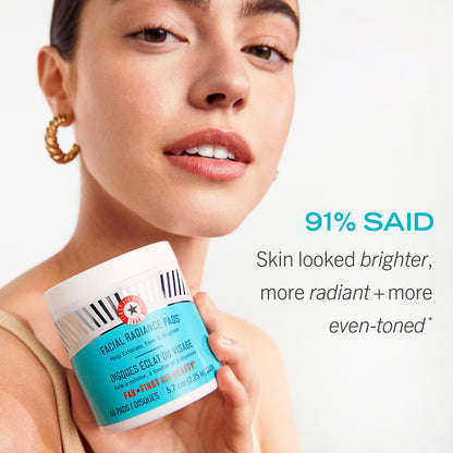 Model holding Facial Radiance Pads.  91% said skin looked brighter, more radiant + more even-toned.