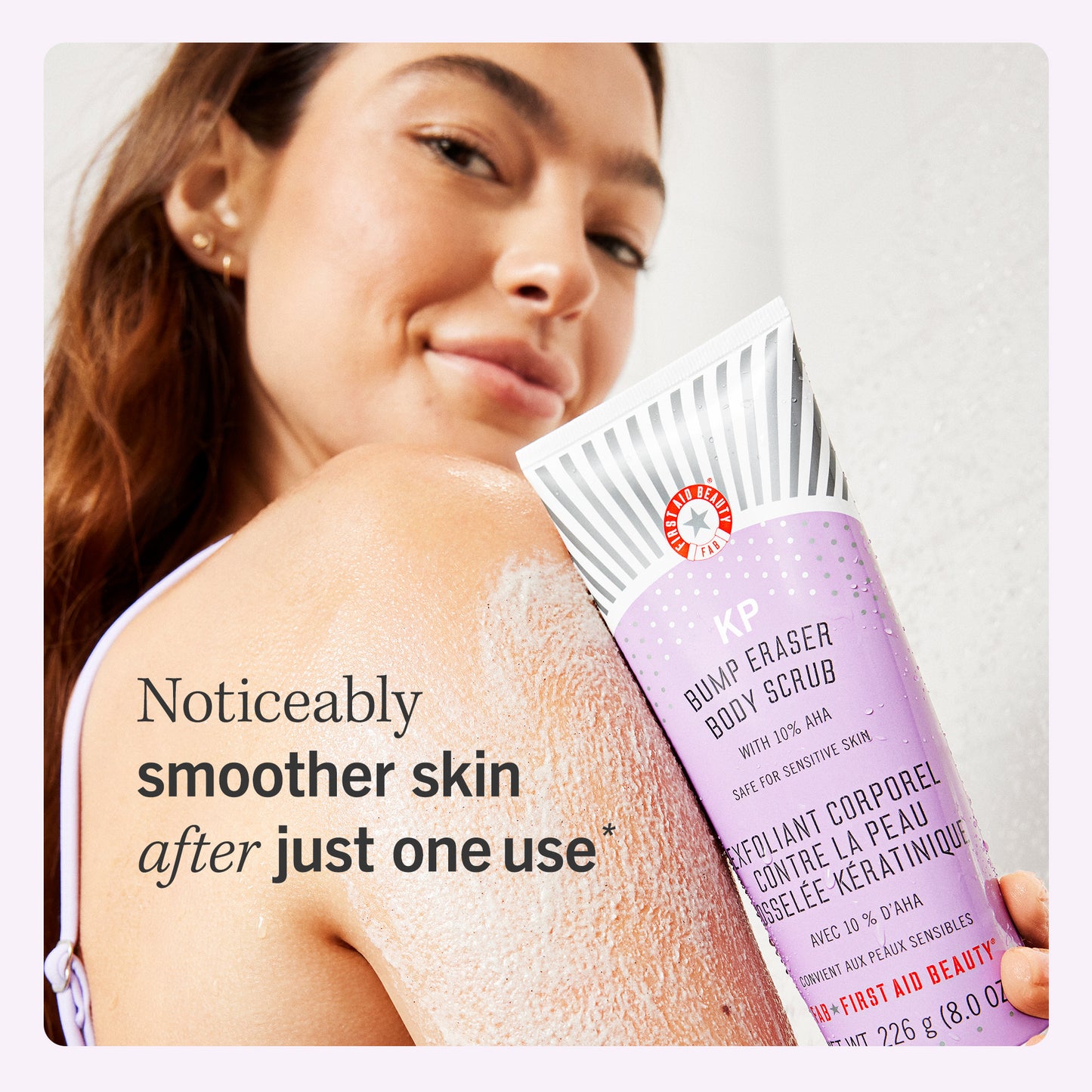 Model with KP Bump Eraser Body Scrub.  Noticeably smoother skin after just one use.