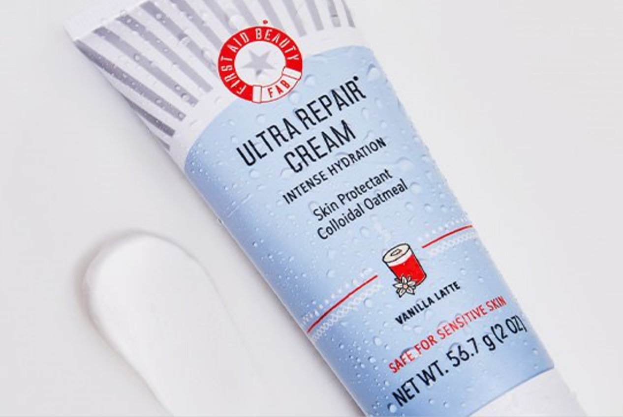 Tube of Ultra Repair Cream on white background with swipe of product next to it